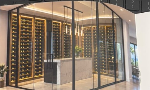 Glass doors enclosing a wine room, shown in Bruno's company magazine